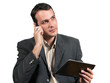 Businessman talking on the phone while holding tablet