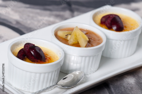 Photo: creme brulee with fresh slice fruits on top creme brulee with fresh slice fruits on top