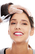 Plastic surgeons giving botox injection
