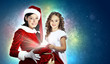 Little girl with christmas gifts and santa