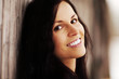 Photo: Young woman is smiling, outside in winter day. Young woman is smiling, outside in winter day.
