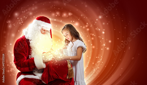 Photo: portrait of santa claus with a girl portrait of santa claus with a girl