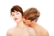 Young lovers intimate kiss