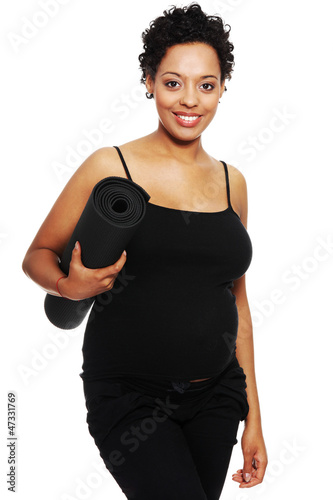 Photo: Pregnant woman exercising, isolated on white Pregnant woman exercising, isolated on white