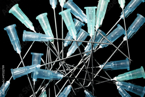 Photo: Medical needles. background Medical needles. background