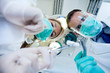Patient's view of the dentist and assistant.
