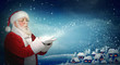 Photo: Santa Claus blowing snow to little town Santa Claus blowing snow to little town