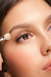 Woman applying eyeshadow
