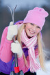 Portrait of blondy young woman with ski in winter time