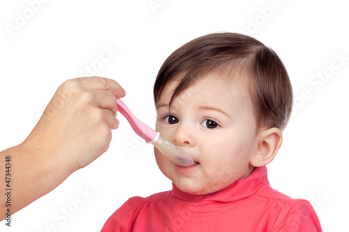 Photo: Baby girl eating Baby girl eating