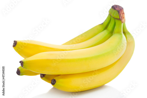 Photo: Bunch of ripe banana fruits isolated on white Bunch of ripe banana fruits isolated on white