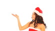 Woman in Santa hat pointing.