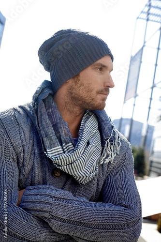 Photo: Trendy young man in hat and scarf Trendy young man in hat and scarf