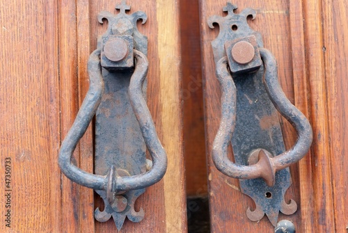 Photo: an old metal door handle knocker an old metal door handle knocker
