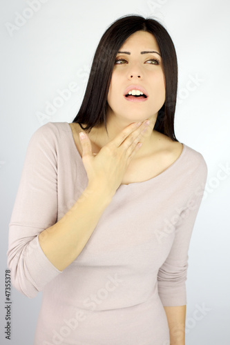 Photo: Beautiful woman with sore throat ill Beautiful woman with sore throat ill