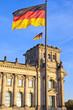 Reichstag with flags in the german capital Berlin