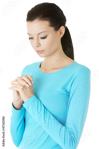 Photo: Portrait of a young caucasian woman praying Portrait of a young caucasian woman praying