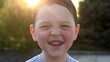little boy laughs and smiles 2