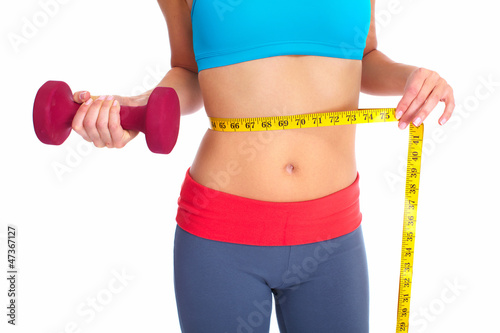 Photo: Beautiful healthy woman with a measuring tape. Beautiful healthy woman with a measuring tape.