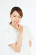 Beautiful young nurse cleaning teeth