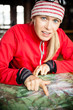 Woman hiker with map planning trip