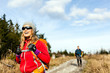 Photo: Couple walking and hiking on mountain trail Couple walking and hiking on mountain trail