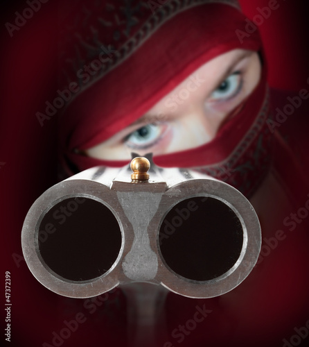 Photo: Terrorist or gangster with shotgun aimed at you. Terrorist or gangster with shotgun aimed at you.