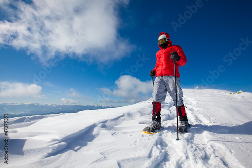 Photo: Hiker in winter mountains snowshoeing Hiker in winter mountains snowshoeing