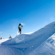 Hiker in winter mountains