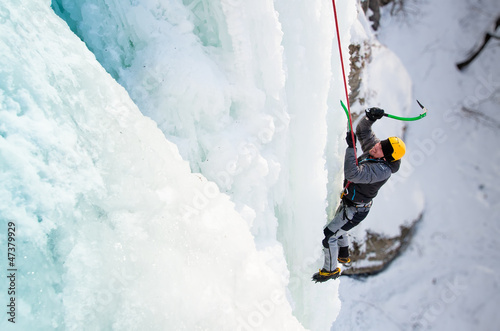 Photo: Man climbing frozen waterfall Man climbing frozen waterfall