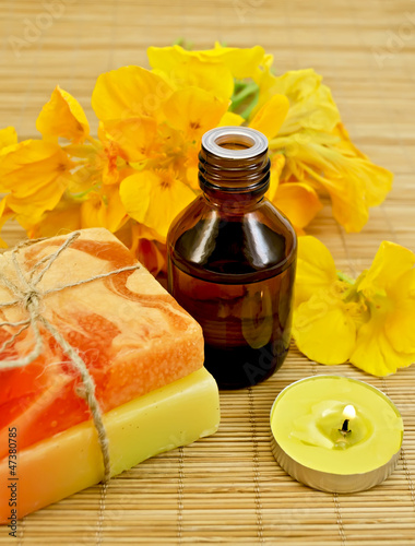 Photo: Oil with nasturtiums and candle Oil with nasturtiums and candle