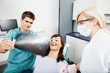 Photo: Dentist With Female Assistant Showing X-Ray Image To Patient Dentist With Female Assistant Showing X-Ray Image To Patient