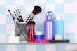 Shelf with cosmetics and toiletries in bathroom