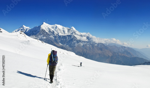 Photo: Lonely trekkers on big snow fieldsin Himalaya Lonely trekkers on big snow fieldsin Himalaya