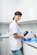 Smiling Female Dentist Working At Clinic