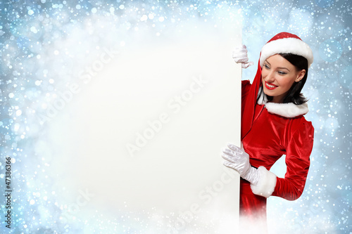 Photo: santa girl with a blank banner santa girl with a blank banner