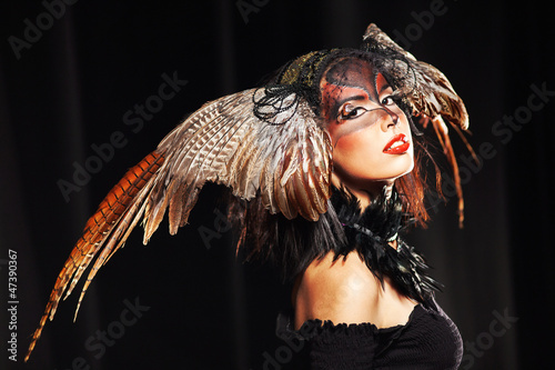 Photo: pheasant fantasy hat on beauty head with make-up pheasant fantasy hat on beauty head with make-up