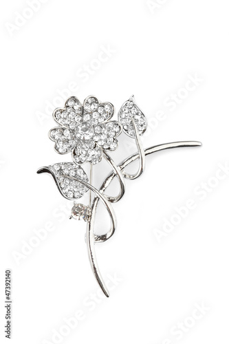 Photo: Beautiful flower brooch, isolated on white Beautiful flower brooch, isolated on white