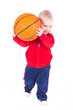 little boy playing with basketball