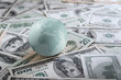 Foto : Earth globe on heap of money Earth globe on heap of money