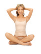 woman practicing yoga lotus pose