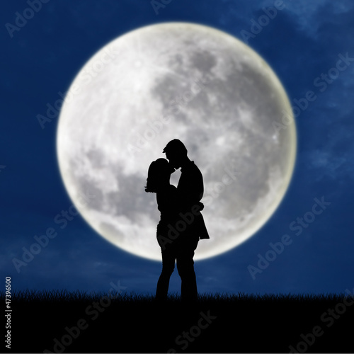 Photo: Close up of silhouette couple kissing on full moon Close up of silhouette couple kissing on full moon