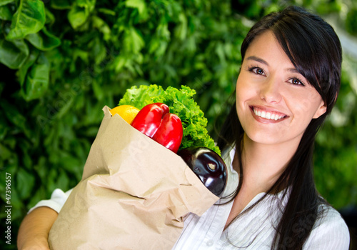 Photo: Woman shopping for groceries Woman shopping for groceries