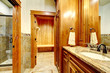 Luxury mountain home bathroom inetrior with stone and wood.
