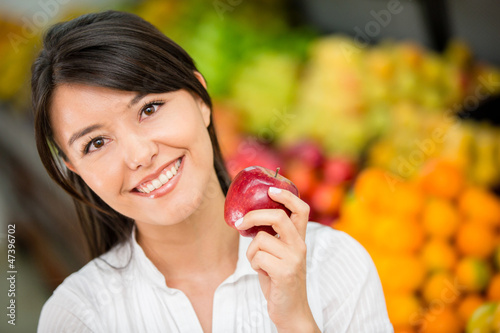 Photo: Woman shopping for groceries Woman shopping for groceries