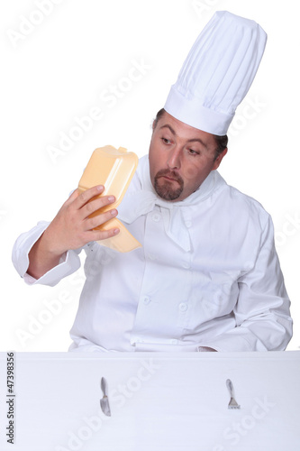 Photo: Chef looking into empty burger box Chef looking into empty burger box
