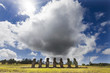 Seven Moais with huge cloud behind