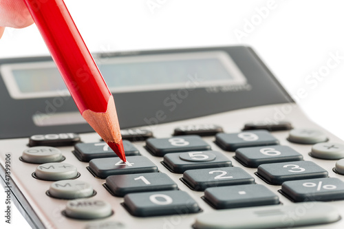 Photo: Rotstift und Taschenrechner Rotstift und Taschenrechner
