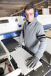 Man wearing ear defenders in a factory
