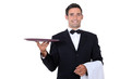 Waiter with tray smoking and balance